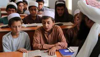 Afghan boys learn Muslim holy book of Quran in Herat