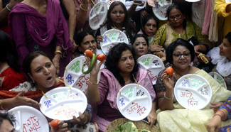 Indian women protest against hiking price of essential commodities