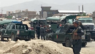 Twin blasts hit police convoy in Afghan capital, killing more than 20