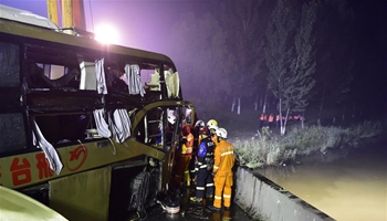 Bus rushes out of expressway in north China, 4 found alive
