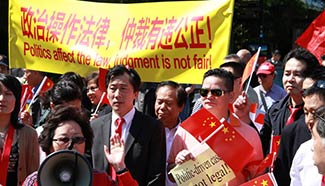 Chinese living in Netherlands rally against ruling on S. China Sea arbitration