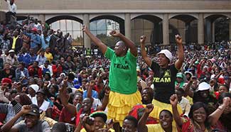 Zimbabwean president's supporters march across center of capital