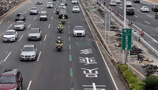 Traffic police patrol along carpool lane, S China