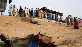 12 killed as passenger bus crashes into trailer in S. Pakistan