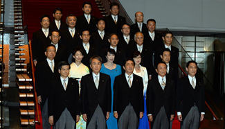 Japan's Abe retains majority of ministers in Cabinet reshuffle