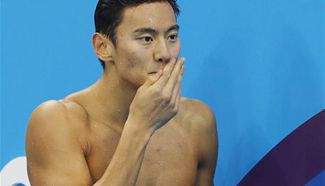 Ning Zetao competes during men's 100m freestyle heat of swimming