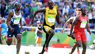Usain Bolt competes during men's 100m at 2016 Rio Olympic Games