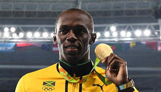 Bolt claims title in men's 100m