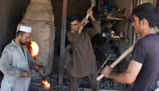 Afghan blacksmiths work at workshop in Mazar-e-Sharif