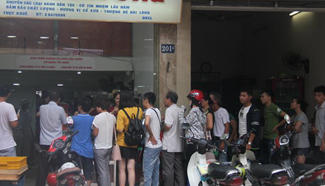 People queue up to buy mooncakes at Bao Phuong shop in Hanoi, Vietnam