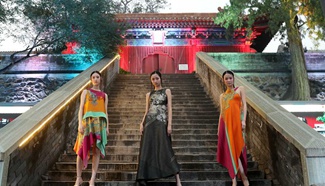 Models present creations of designer Wu Haiyan at Fahai Temple
