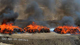 Piles of burning drugs seen during ceremony in SW Pakistan