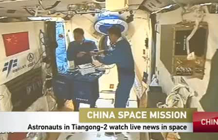 Astronauts in Tiangong-2 watch live news in space
