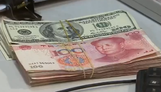 Chinese currency firms against USD