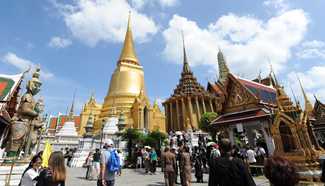 Tourists visit Wat Phra Kaew temple in Bangkok, Thailand