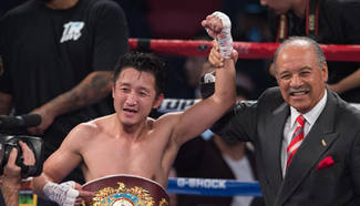 Zou Shiming wins WBO flyweight title boxing match in Las Vegas