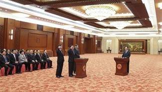 New officials attend oath-taking ceremony in Beijing