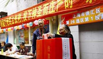 People vote in local legislative elections in Shanghai