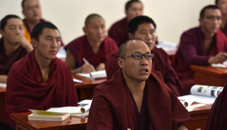 Monks have lesson at Qinghai Tibetan Buddhism college in NW China