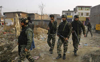Indian soldiers take position after militant attack in Indian-controlled Kashmir