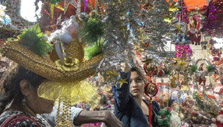 People buy Christmas trees and decorations in Kolkata, India