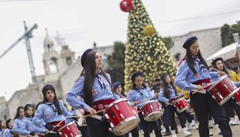 Palestinians perform during Christmas celebration in Bethlehem