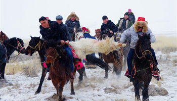 Kazak people hold goat grabbing event in NW China's Xinjiang