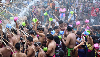 Balinese people participate in ritual water war to celebrate New Year