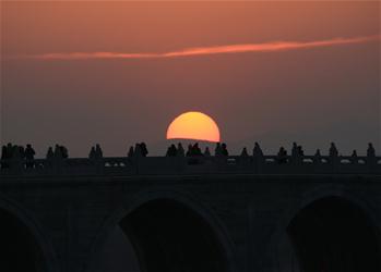 Sunset view at Seventeen-Arch Bridge of Summer Palace seen in Beijing