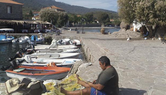 Greek fishermen saving refugees to be helped by prize money in boat repair