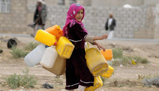 Yemeni people get clean water at outskirts of Sanaa