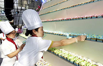 Cupcake makers build cake pagoda in central China's Luoyang