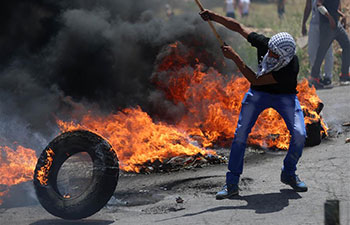 Palestinian people clash with Israeli soldiers at protest marking 69th anniversary of "Nakba"