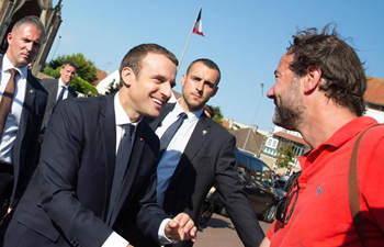 Macron greets supporters after 2nd round of parliamentary elections