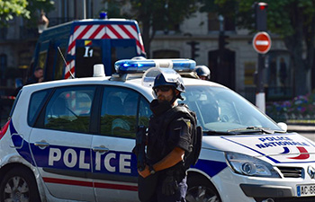 Car with explosives rams into police van in Paris, driver dies: minister