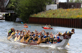 Participants compete in dragon boat race in Chicago