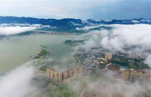 Clouds drift over Three Gorges Dam after rainfall in China's Hubei