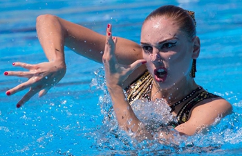 Russia's Kolesnichenko wins gold at synchronized swimming solo free event