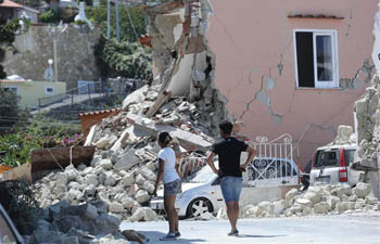 Rescuers race against time on Italy's Ischia Island, after quake kills two