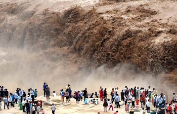 Water volume of Hukou Waterfall surged due to heavy rainfall