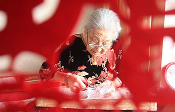 In pics: papercuttings made by 103-year-old woman