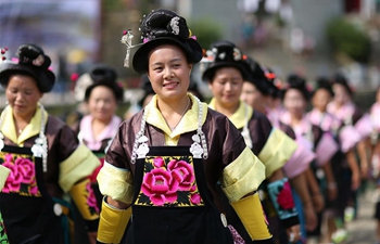 Miao people dance to celebrate "Chixin Festival" in SW China's Guizhou