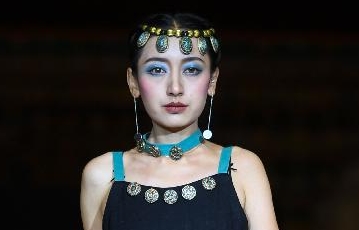 Models present fashion creations with Tibetan medicine designing characteristics in Lhasa