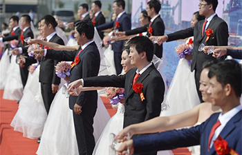 21 pairs of newlyweds attend group wedding ceremony in N China's Hebei