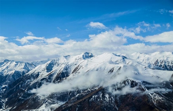 Aerial view of snow-covered Bayan Har Mountains in China's Qinghai