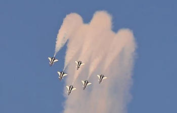 China Air Force Bayi Aerobatic Team stunts at Dubai Airshow