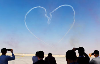 Al Fursan aerobatics demonstration team perform at Dubai Air Show