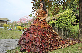 Dress made of 5,888 leaves seen in S China's Guangdong