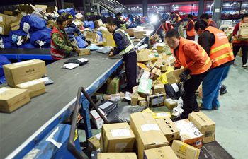 Workers busy dealing with parcels after Singles' Day