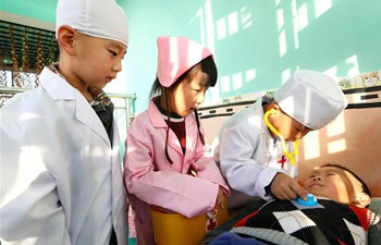 Children experience adult jobs at kindergarten in E China